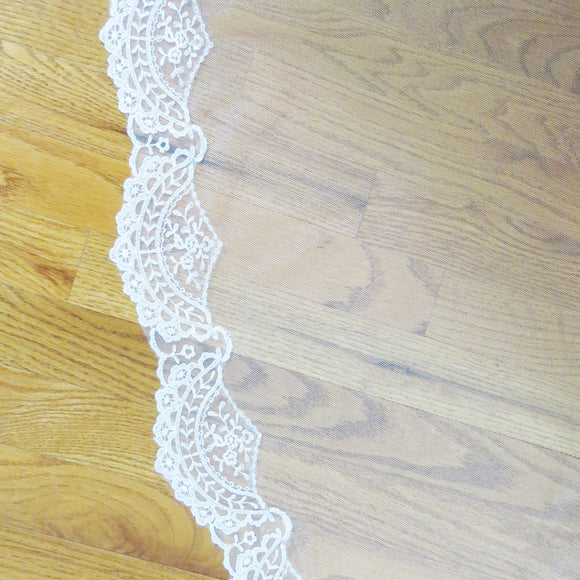 Spanish lace veil in ivory detail of scallop shaped lace