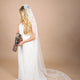 bride with vintage camera in mantilla veil