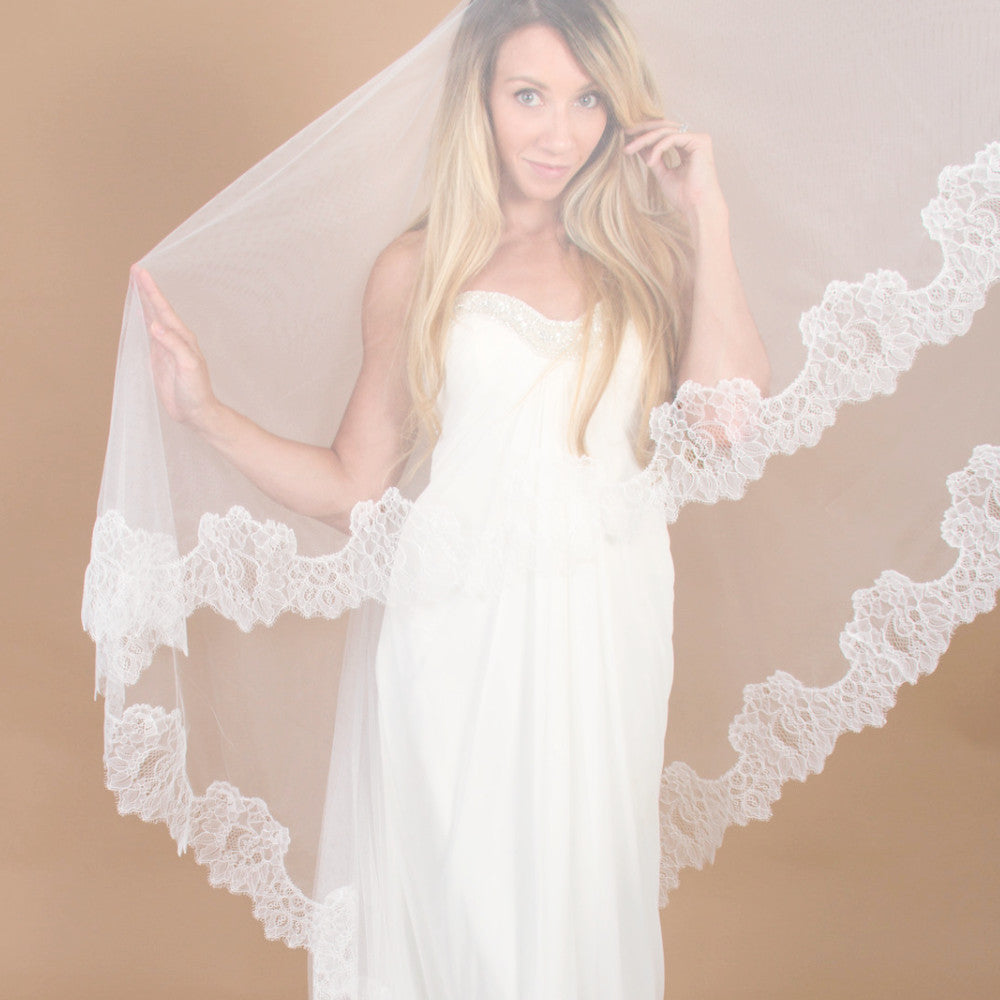 https://www.themantillacompany.com/cdn/shop/products/Lace-cathedral-veil-mantilla-style-lucia-with-blusher-bride-posing_262d4503-0c36-4333-95fc-44dc58f44239.jpg?v=1559161884