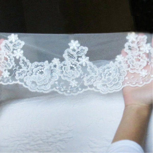 lace veil cathedral length with rose pattern from The Mantilla Company