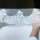 lace veil cathedral length with rose pattern from The Mantilla Company